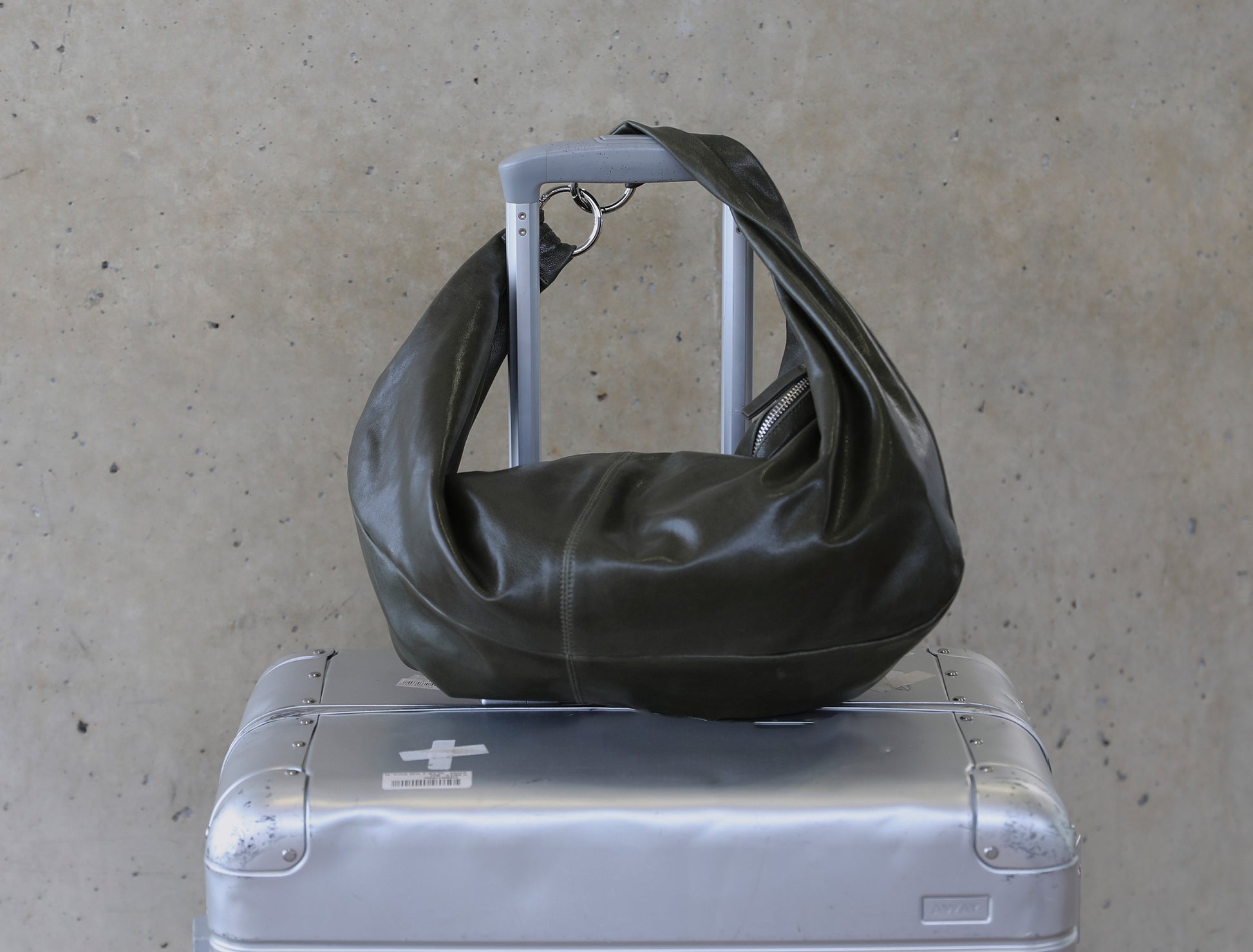 Dry elongated wrap around hobo style shoulder bag khaki