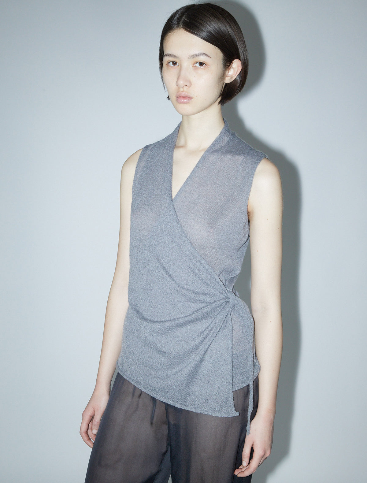 SANS-Grey sleeveless wrap top with a side loop to tie the