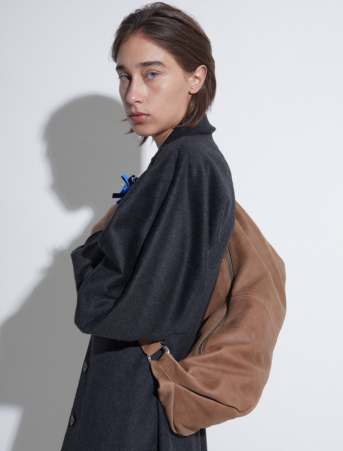 Dry elongated wrap around hobo style shoulder bag brown