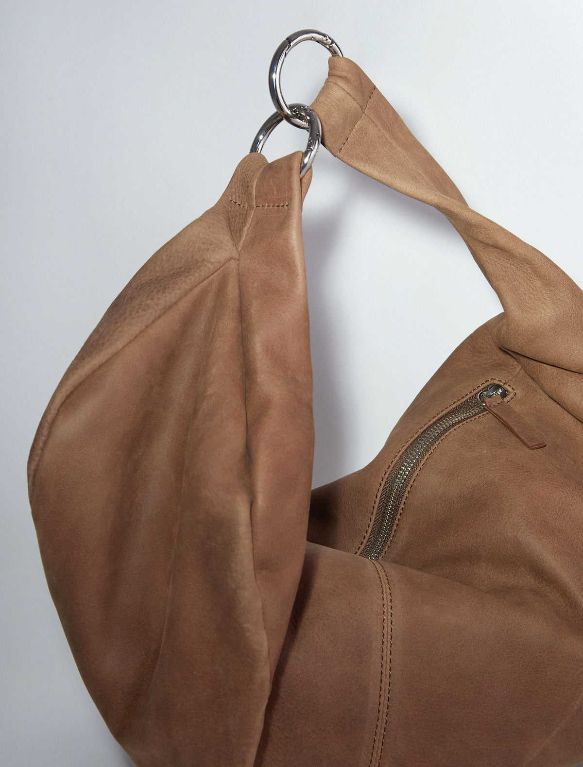 Dry elongated wrap around hobo style shoulder bag brown