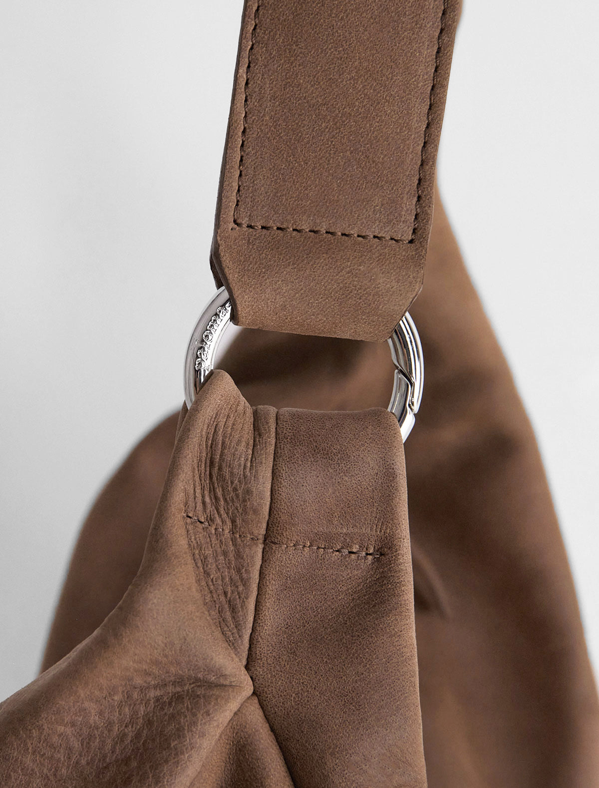 Dry elongated wrap around hobo style shoulder bag brown