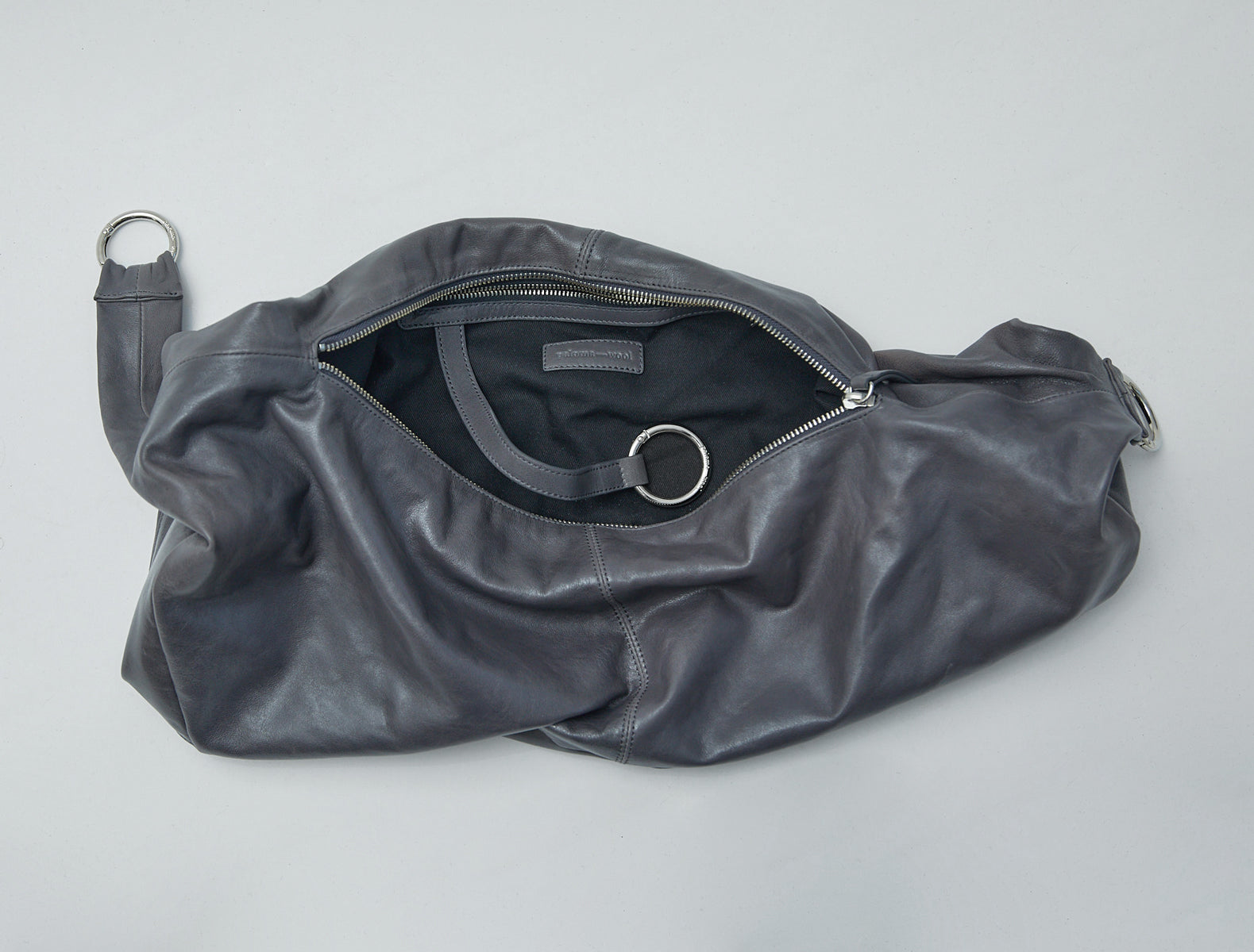 Dry elongated wrap around hobo style shoulder bag grey