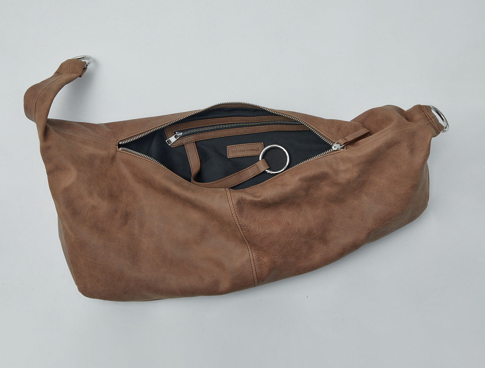 Dry elongated wrap around hobo style shoulder bag brown