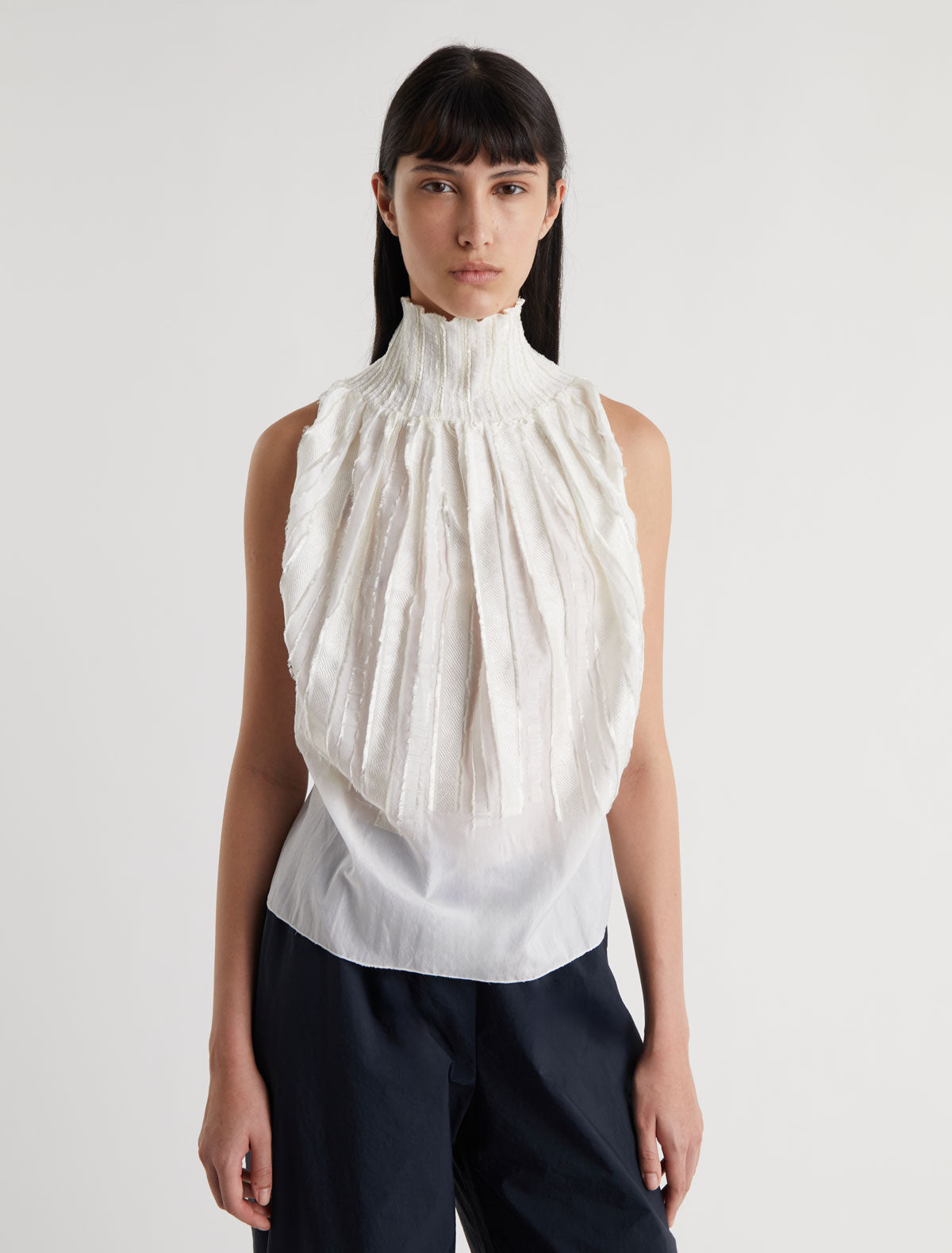 LUPE TOP-White halter top with a tie-back fastening for an
