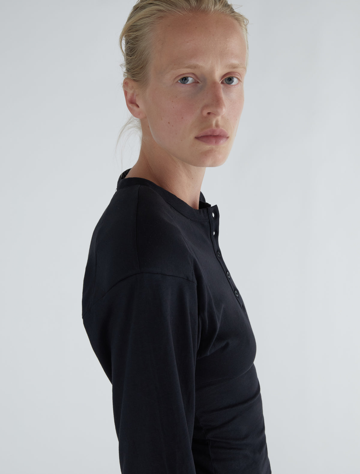 Ryno long sleeved top henley neckline shoulder pads black