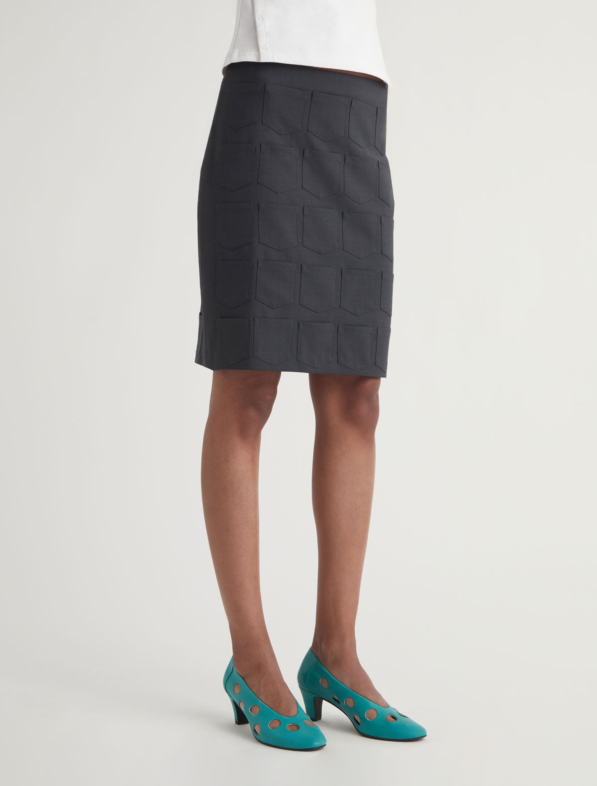 QUINA POCKETS-Mid-length skirt featuring mini pocket details