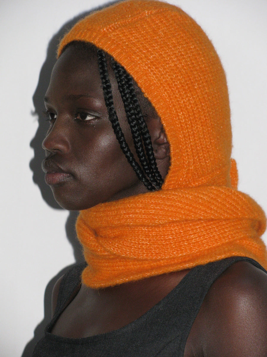 Coucou-Orange warm knitted bonnet with a wide tie to wear around your neck