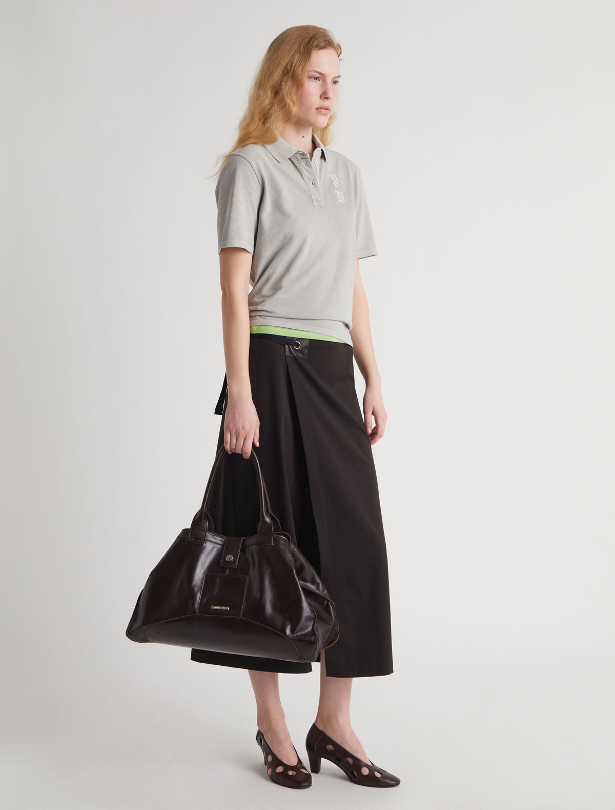 BLONT-Long wrap-style skirt with a leather tab and eyelet detail BLONT-Long wrap-style skirt with a leather tab and eyelet detail