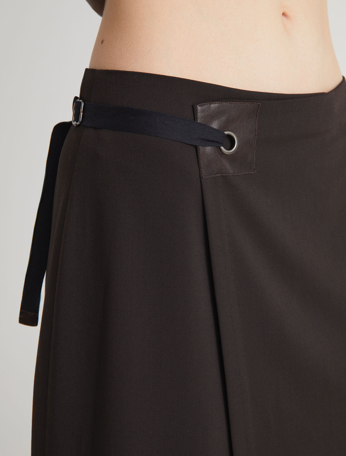 BLONT-Long wrap-style skirt with a leather tab and eyelet detail