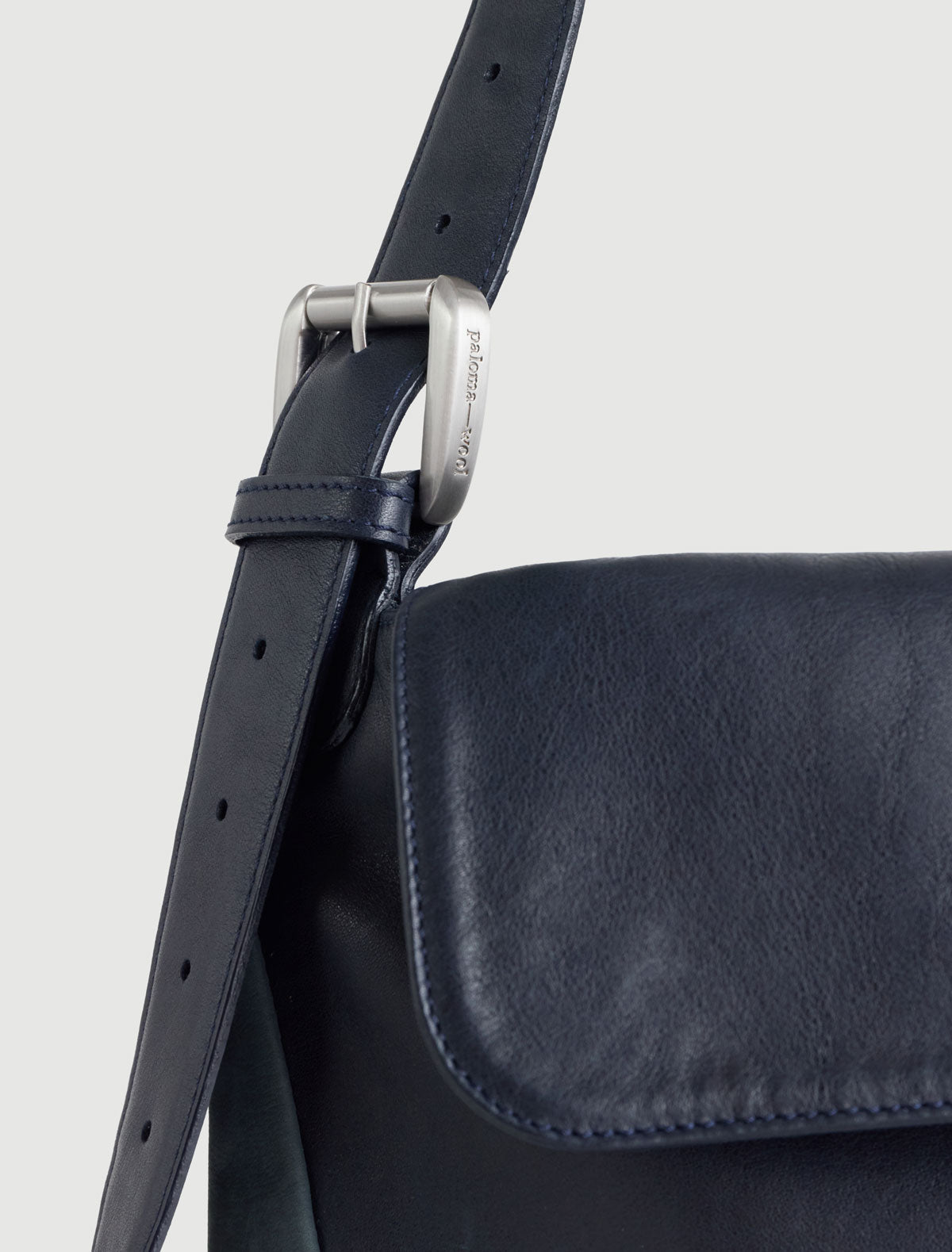 Cairo crossbody bag contrasting leathers eyelet detail navy
