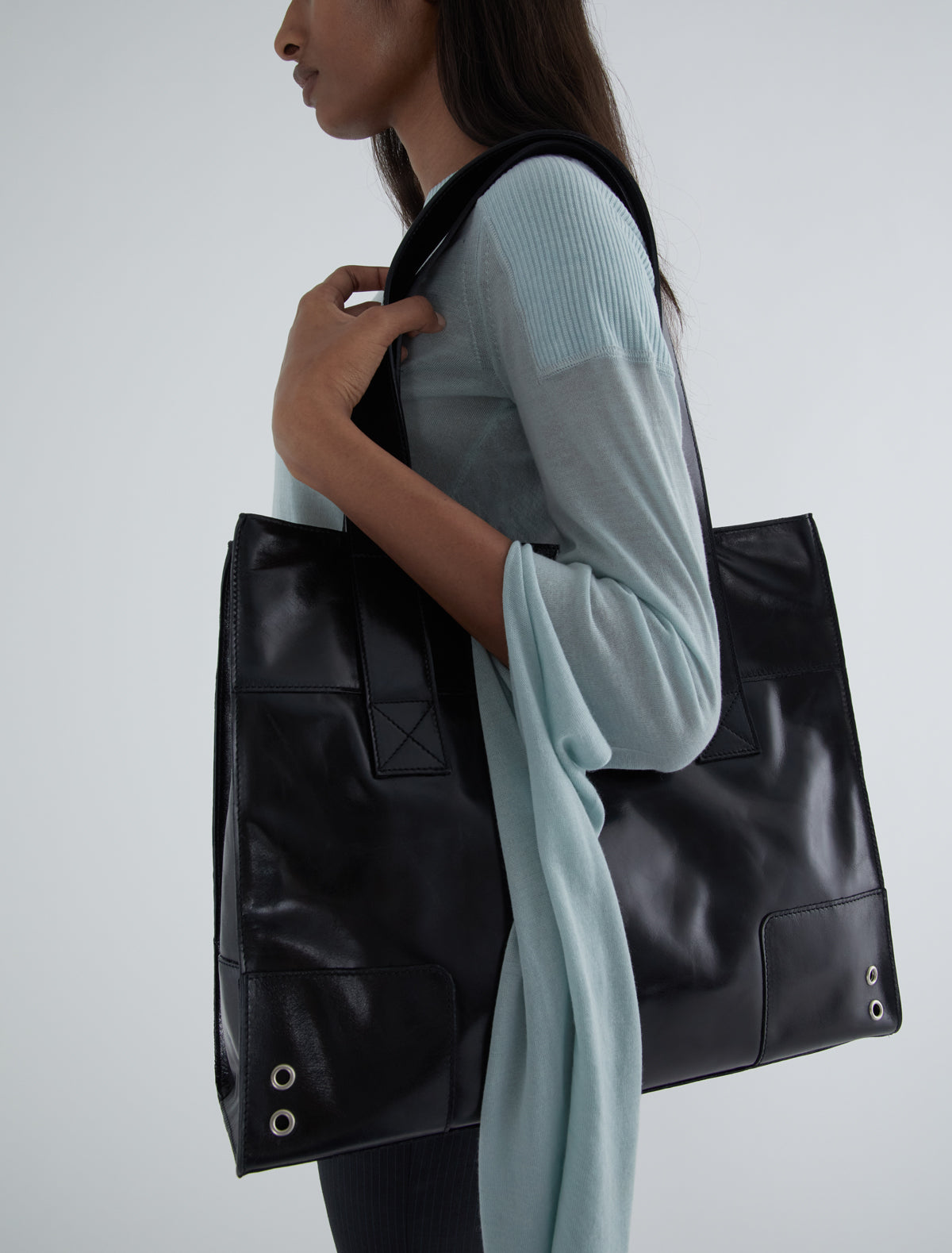 Marga square sack style bag silver grommet details black