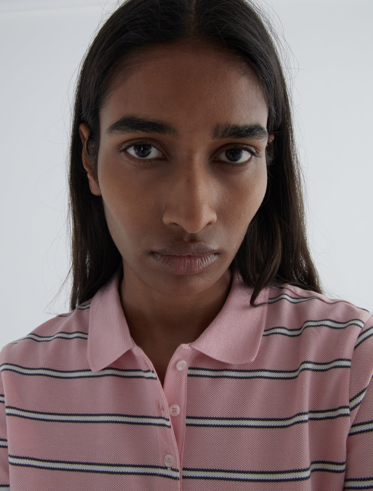 Julieta striped pique polo buttoned placket lower front pink