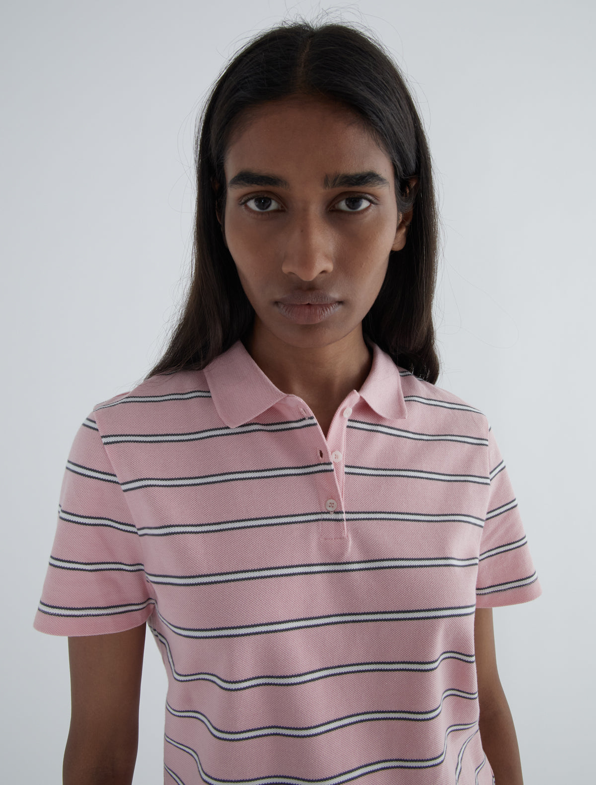 Julieta striped pique polo buttoned placket lower front pink