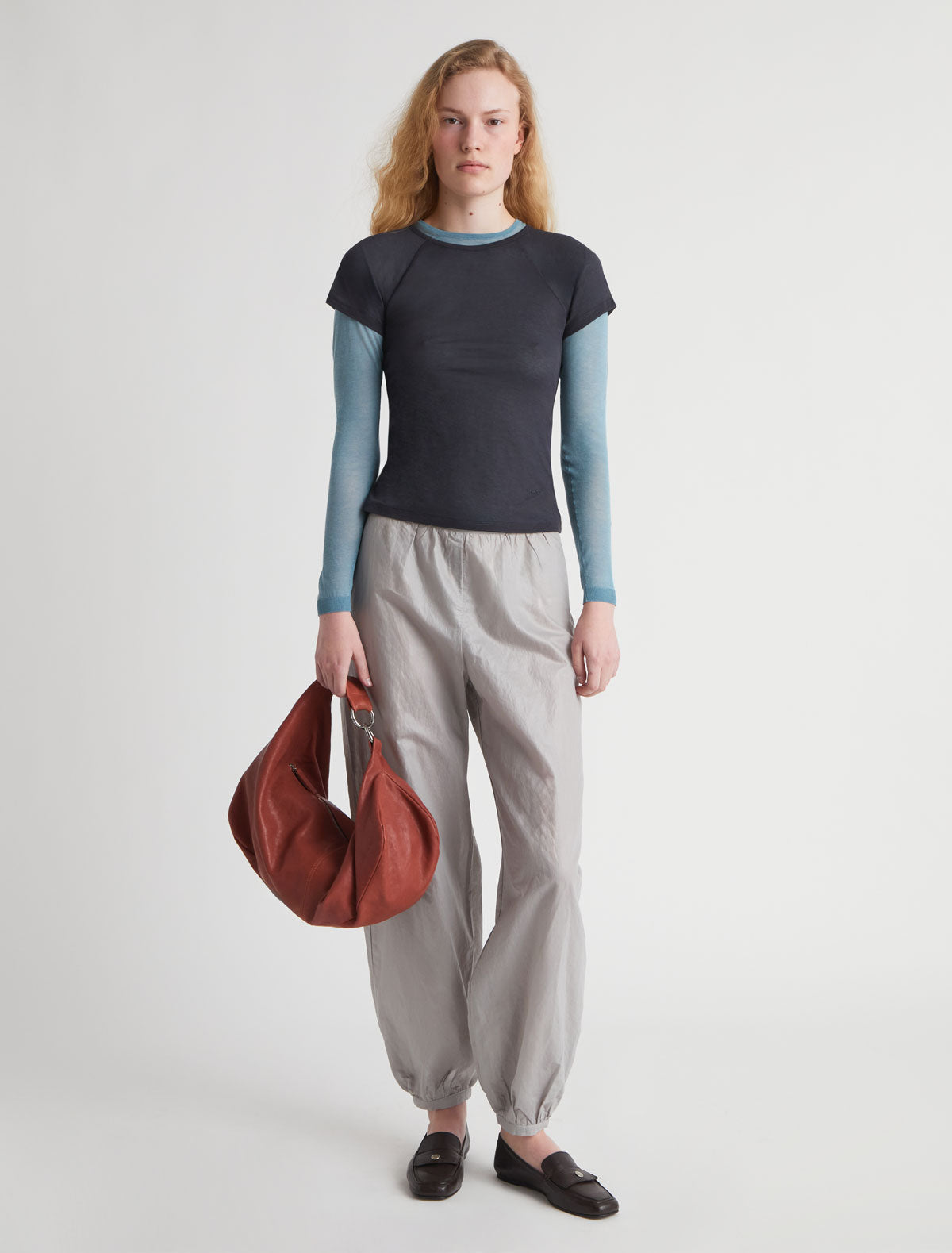 Dry elongated wrap around hobo style shoulder bag terracotta