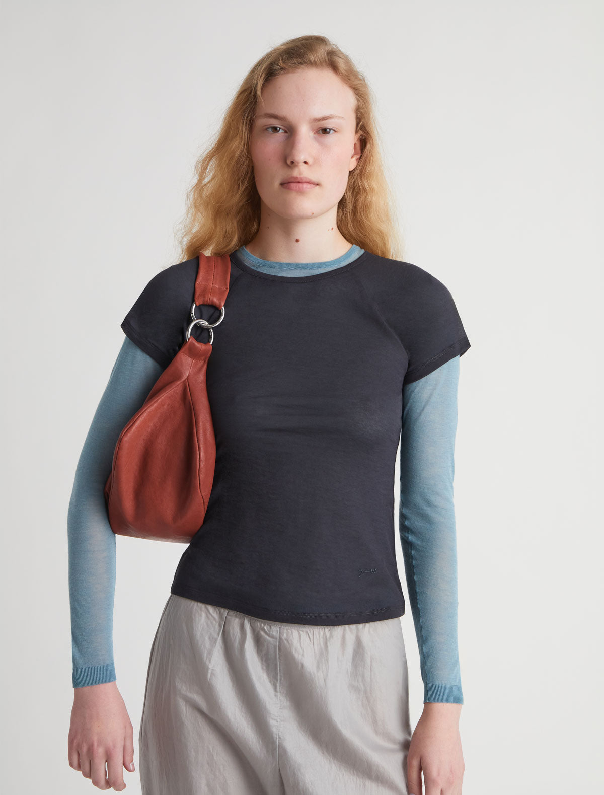 Dry elongated wrap around hobo style shoulder bag terracotta