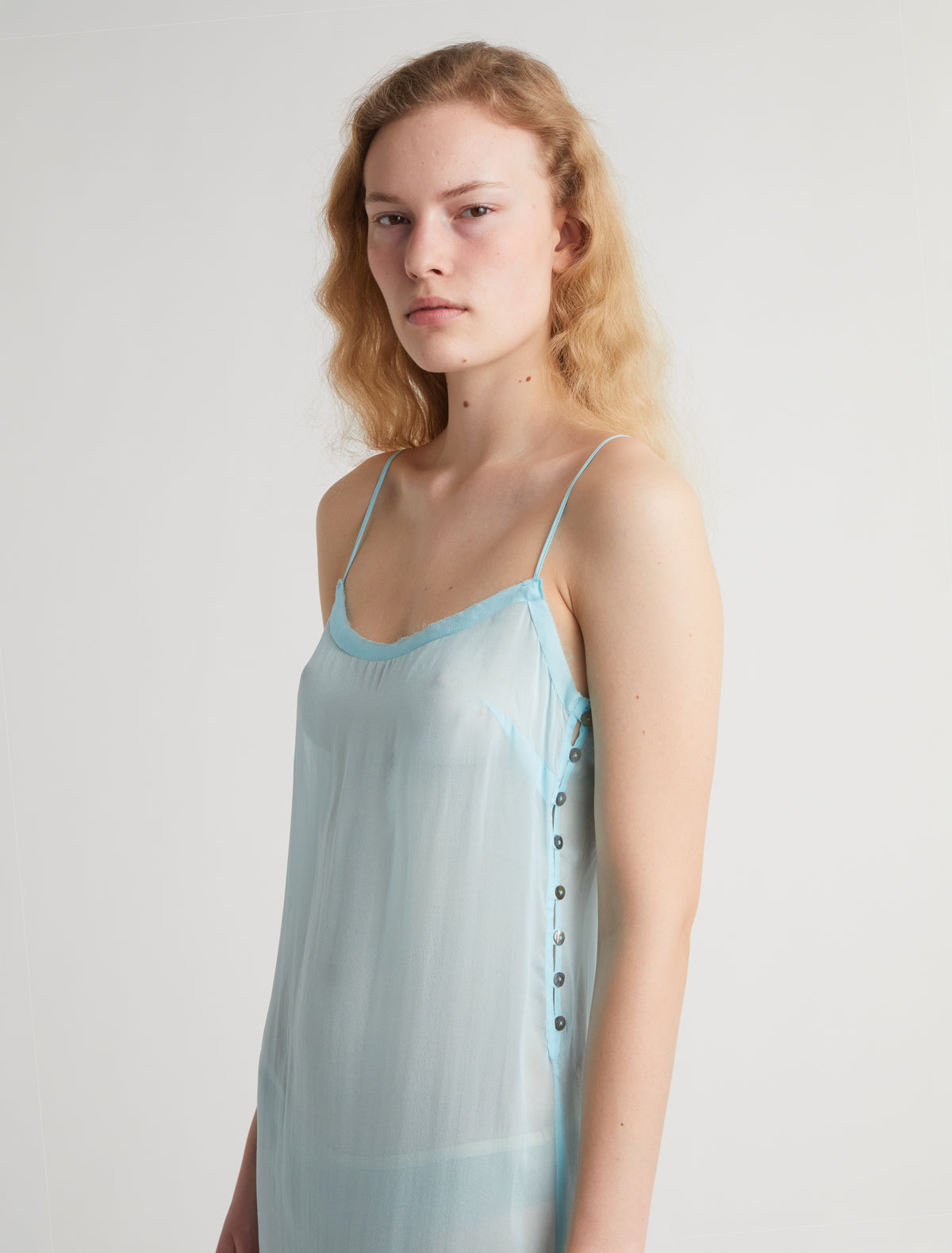 ENOS-Blue midi silk slip dress with thin straps and a ruffle
