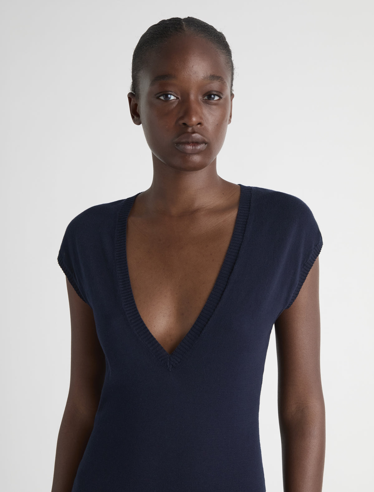 HARI-Navy sleeveless knitted top with a deep V-neck and a