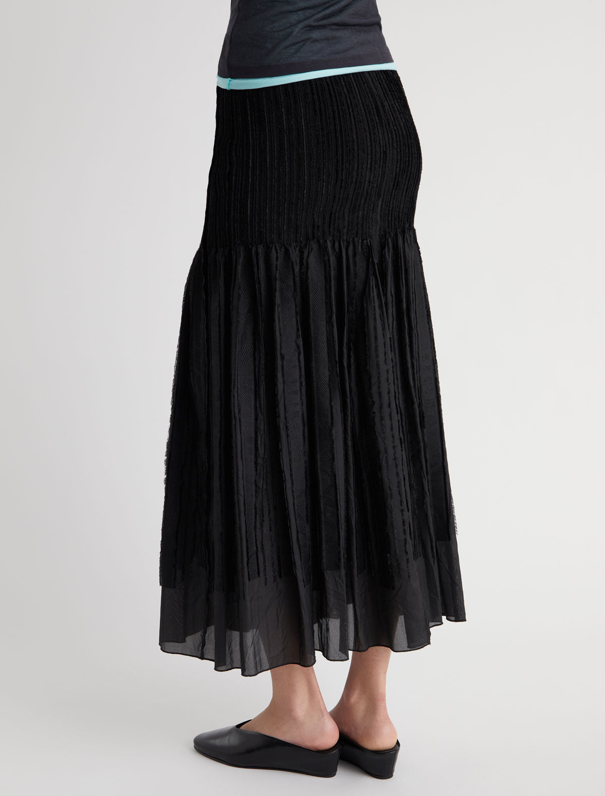 Long lupe long flared skirt fitted upper section volume bottom