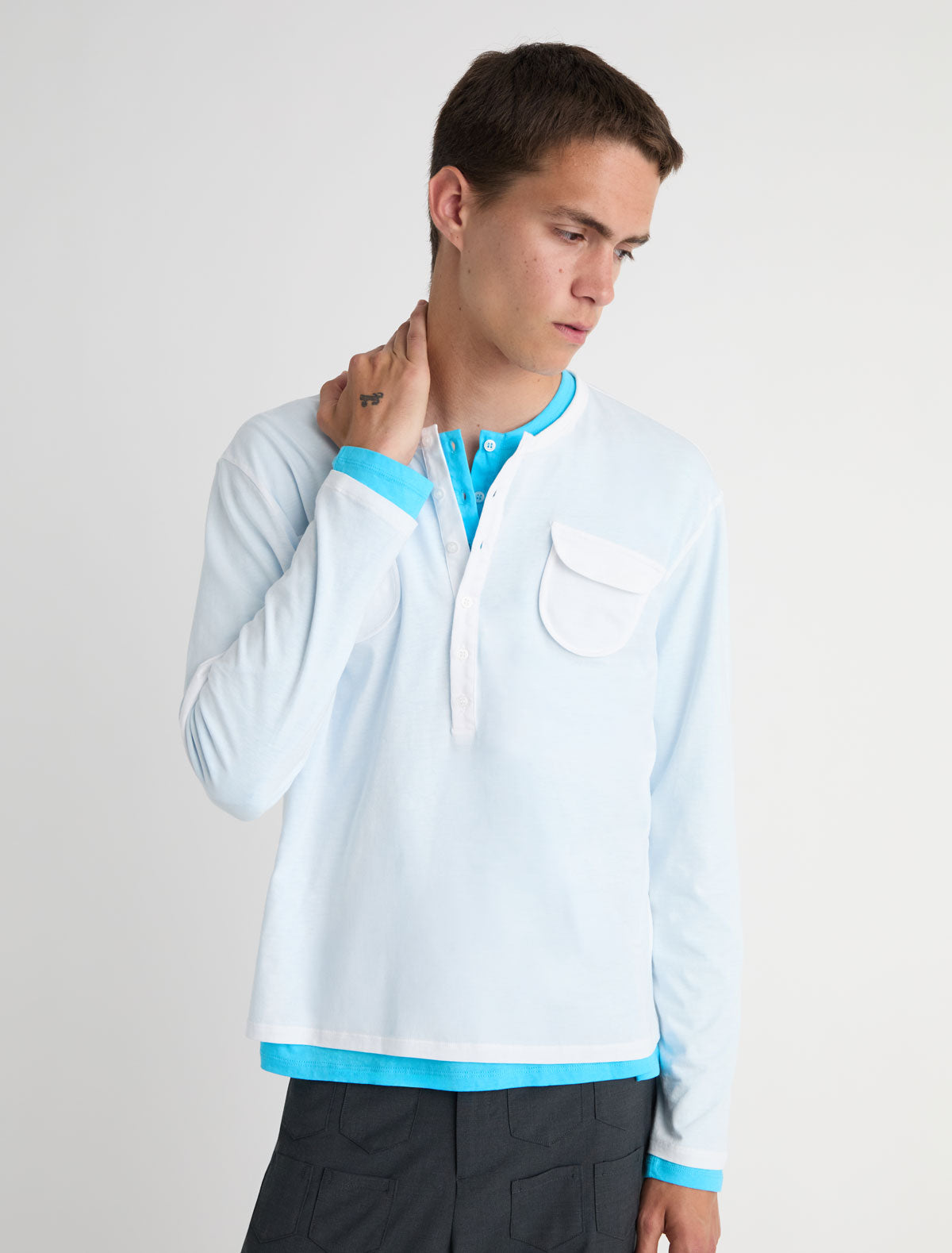 Nestor b long sleeve top crewneck chest pockets central button placket white
