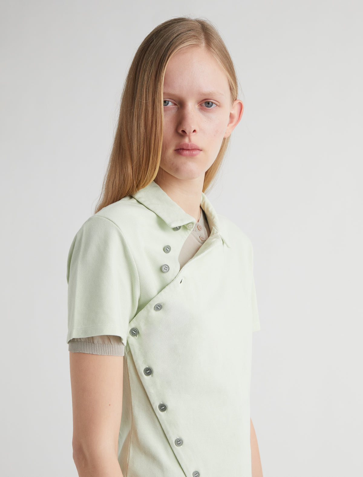 Nico short sleeved asymmetric buttoned top green