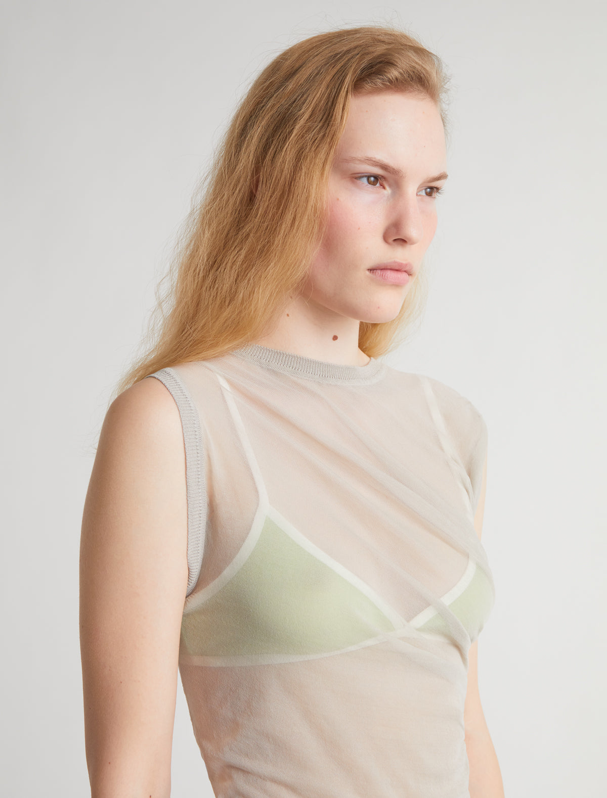 RAVEN II-Beige asymmetrical knit top with draped detailing