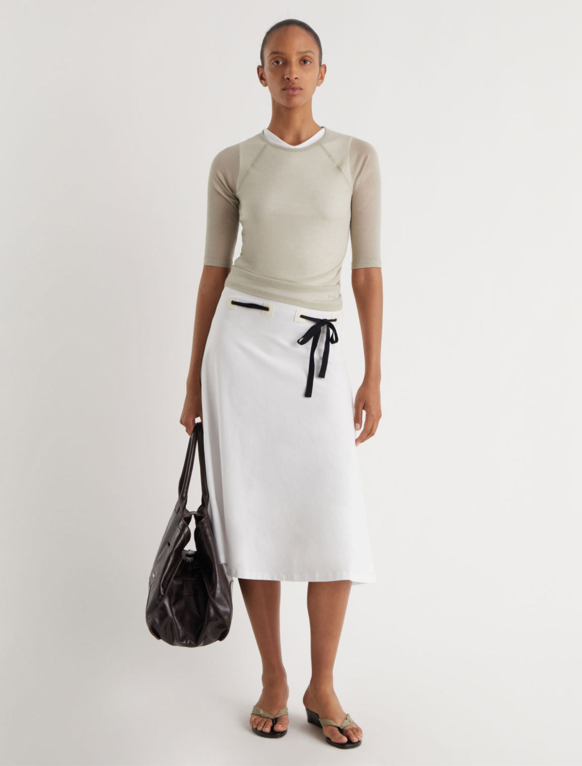SUNI-White dress with fabric patch details at the hips featuring