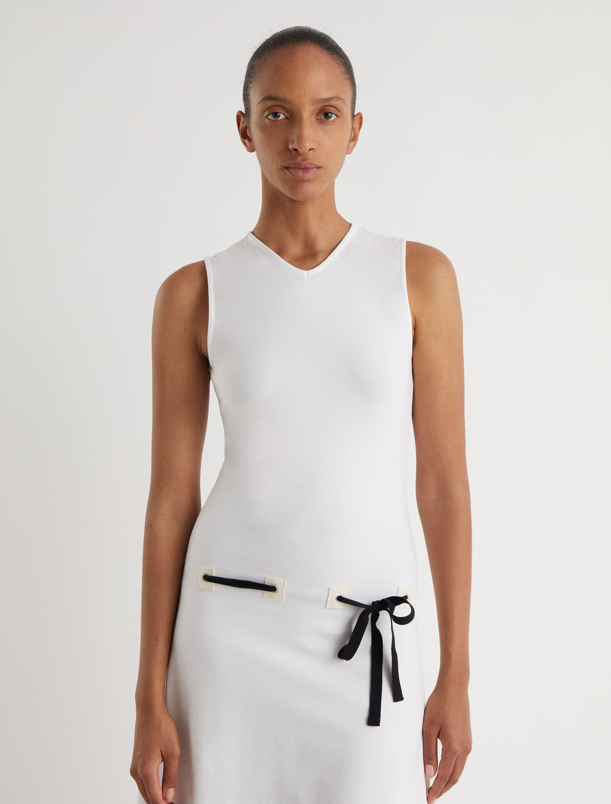 SUNI-White dress with fabric patch details at the hips featuring