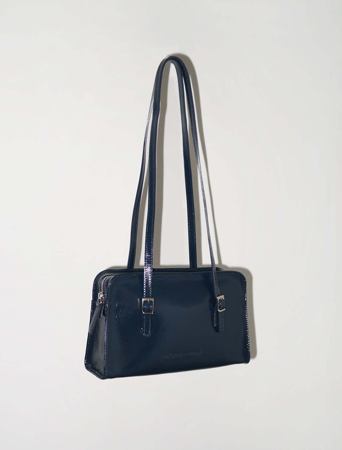 CAYETANO-Navy leather bag with engraved logo and inside pocket.