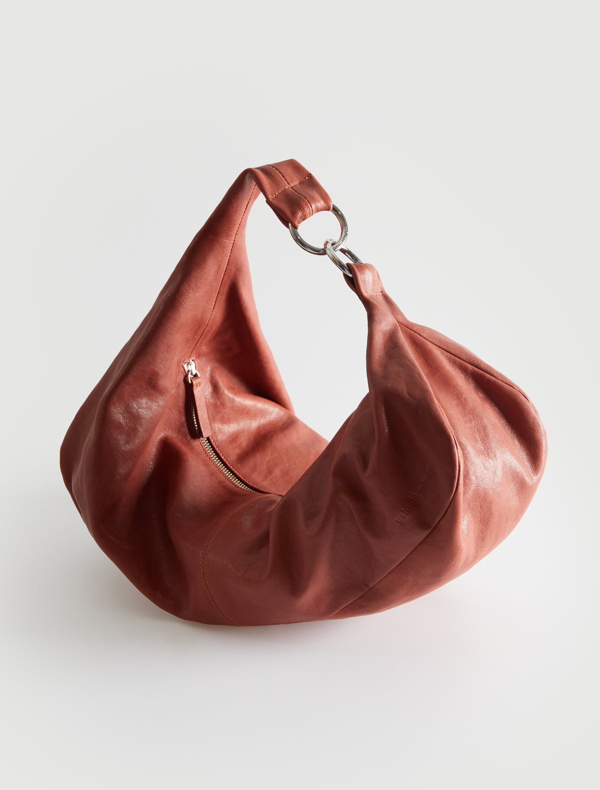 Dry elongated wrap around hobo style shoulder bag terracotta