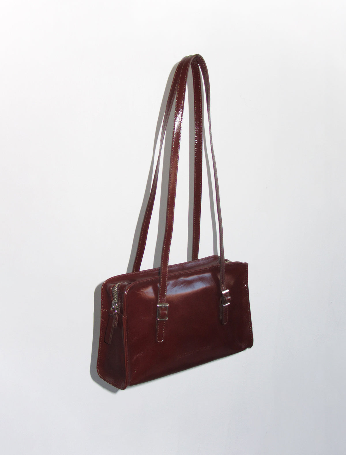 CAYETANO- Brown shiny leather bag with engraved logo