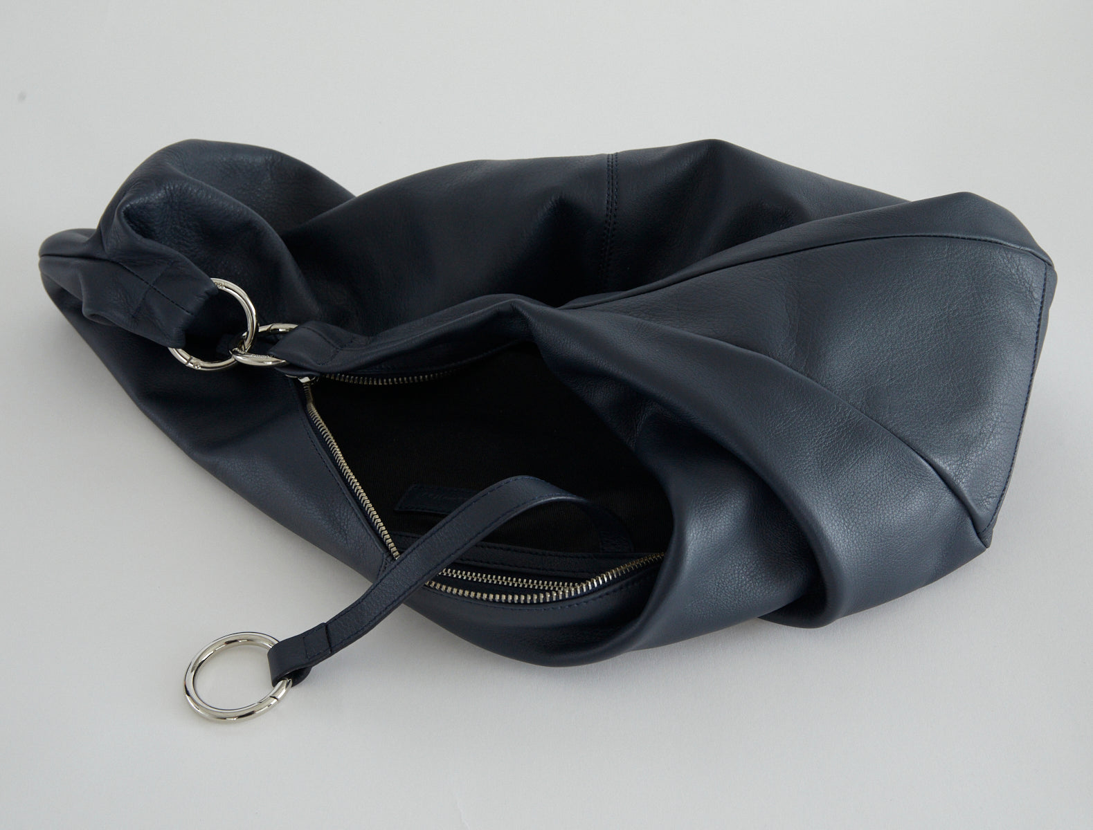 Dry elongated wrap around hobo style shoulder bag navy