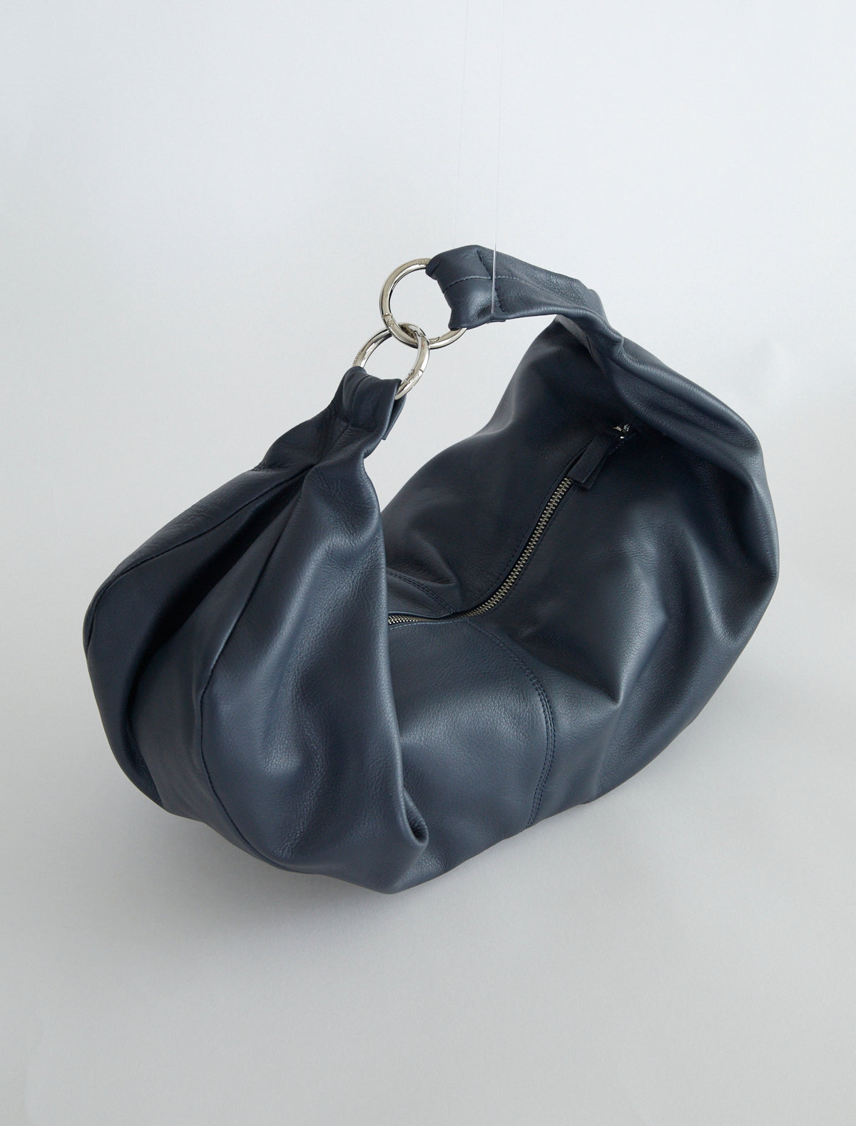 Dry elongated wrap around hobo style shoulder bag navy