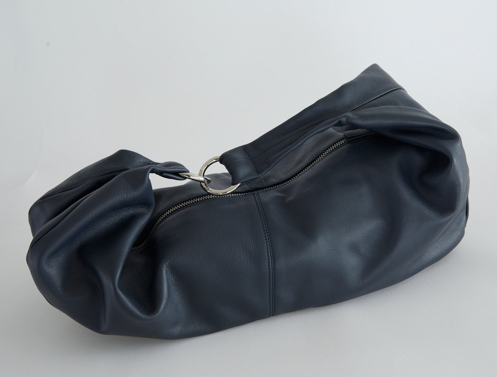 Dry elongated wrap around hobo style shoulder bag navy
