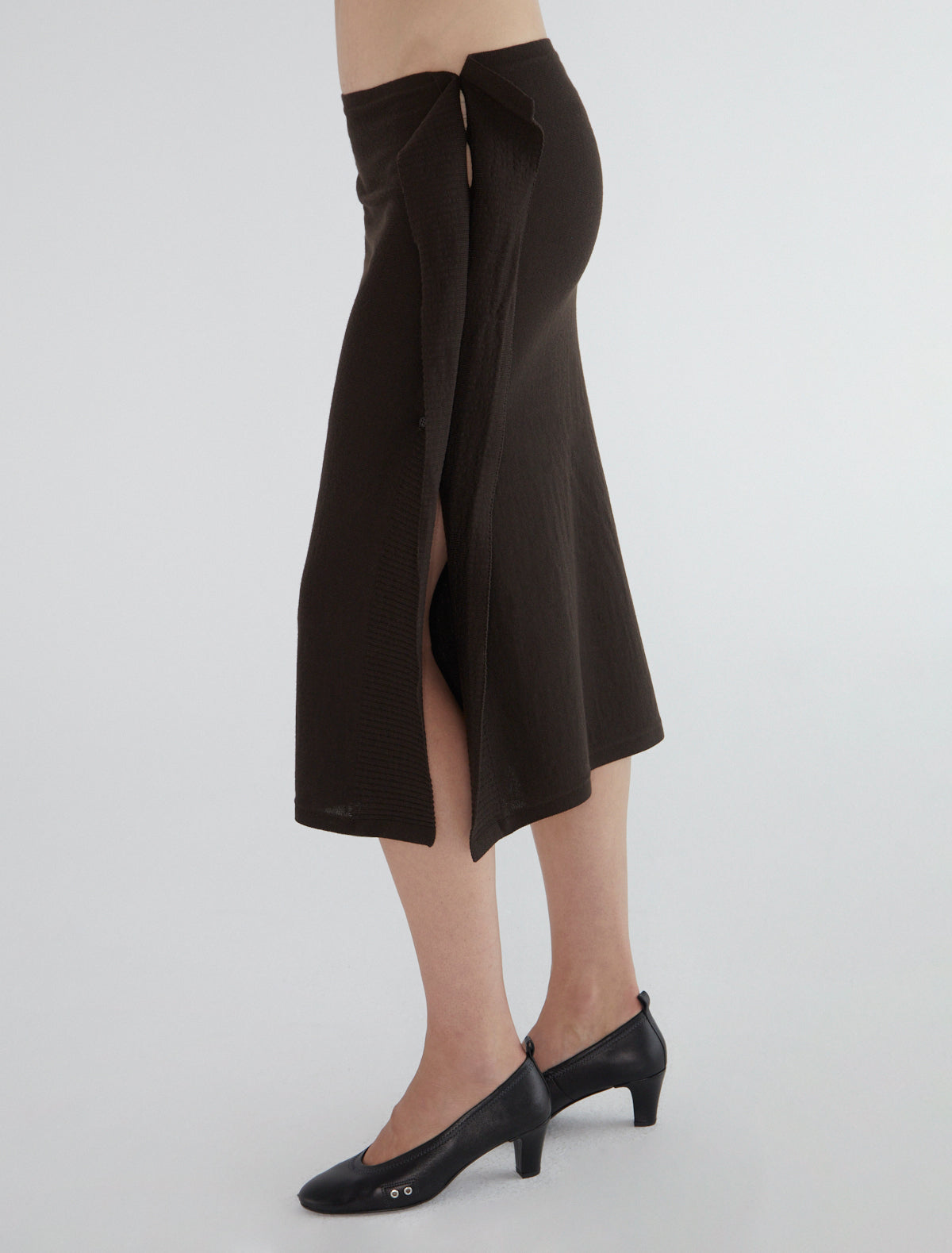 CHARCO-Wrap skirt, featuring side buttons for opening and closure