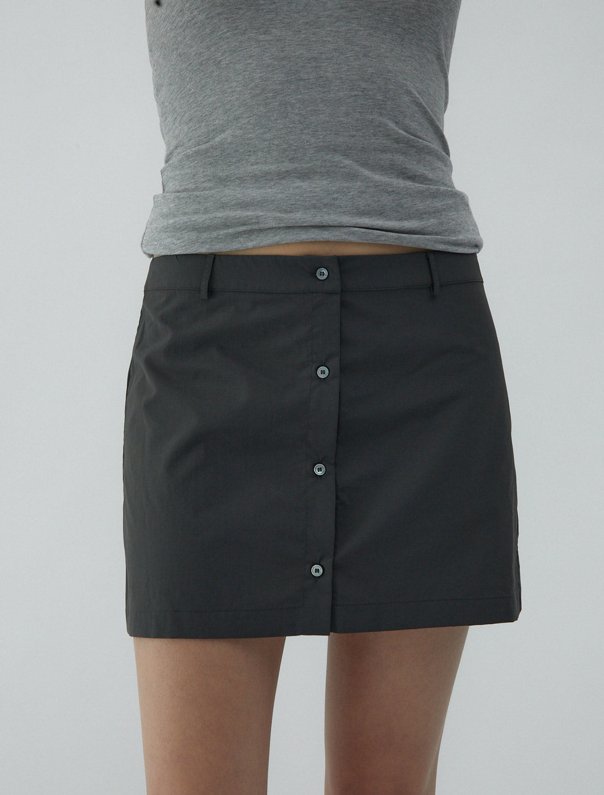 Mini ice tea nylon mini skirt central button closure