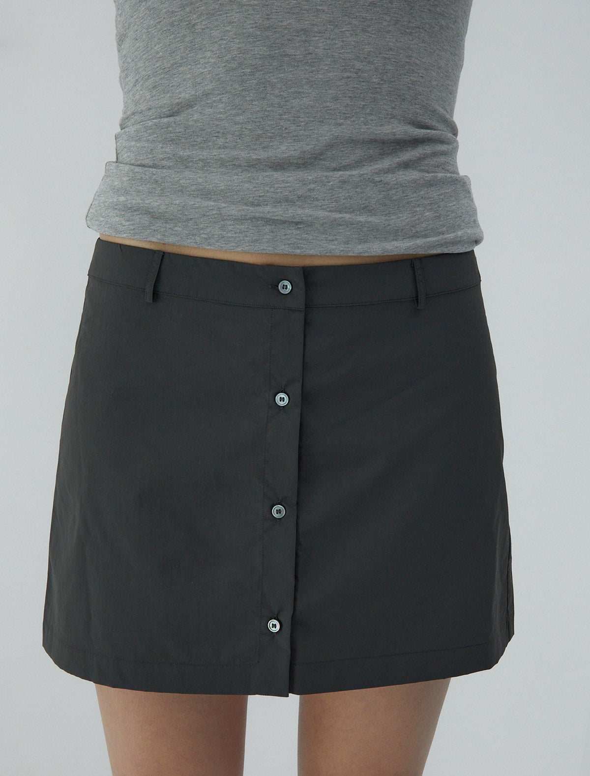 Mini ice tea nylon mini skirt central button closure