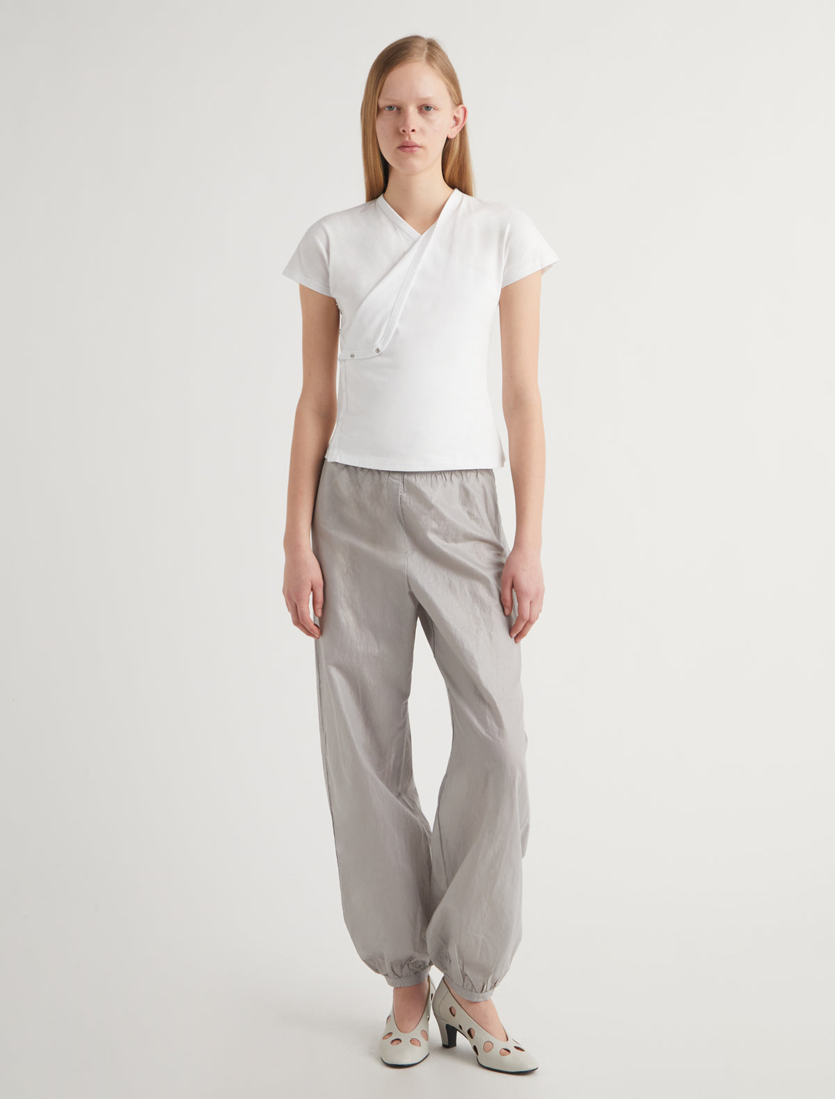 OLIMPIA-White crossed raglan top with side snap closures and