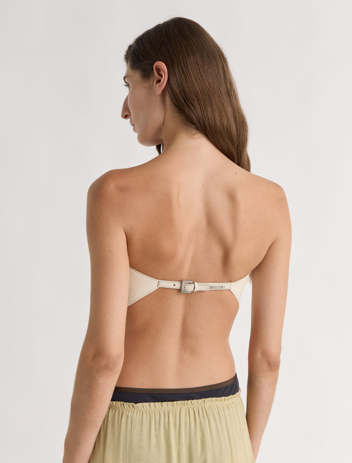 Alba top triangle shaped leather top scarf like silhouette metal buckle closure offwhite