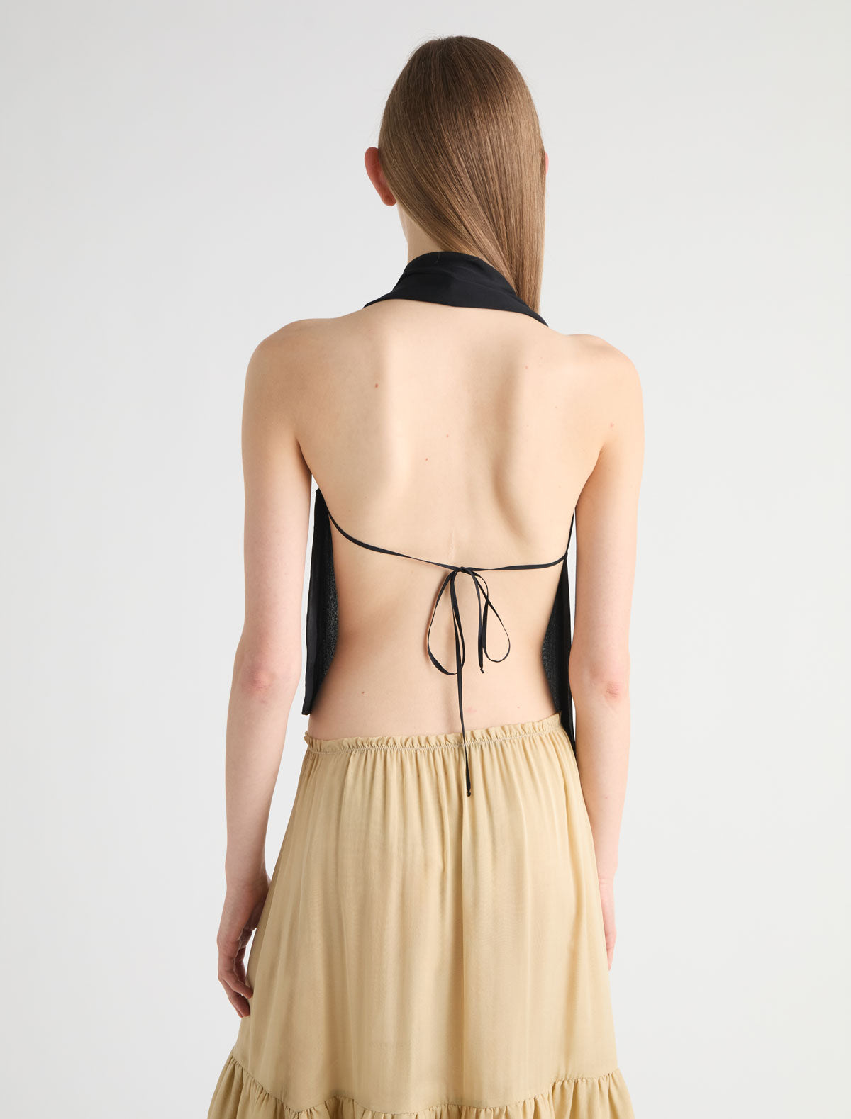 キムホノ JINNO-Black silk top with a double-slider front zip closure